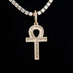 Introducing the Diamond Baguette Ankh Cross Pendant in 18k Yellow Gold. This ancient Egyptian cross symbolizes life, featuring a teardrop shaped hoop with a connected cross directly below it to represent the sun making its way over the horizon. Fully iced out in hand-set baguette stones, this piece will instantly draw attention and shine from every angle. This product is guaranteed for life - GLD will repair the item should you experience any defects in craftsmanship or breakage. Specifications Luxury Gold Ankh Jewelry, Egyptian Cross, Ankh Cross, Diamond Baguette, Vermeil Jewelry, Custom Earrings, Cuban Chain, Baguette Diamond, Pendant Bracelet