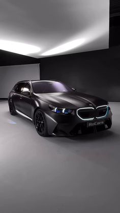 the bmw concept car is shown in an empty room