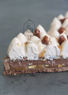 a piece of cake with marshmallows and nuts on top