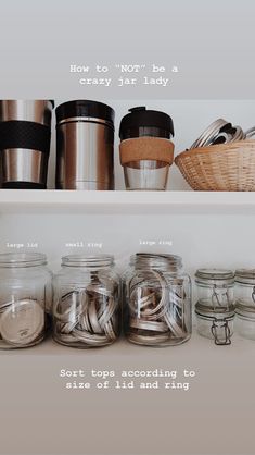 there are many jars on the shelves with words above them