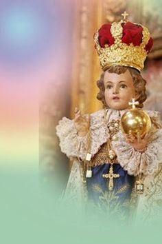 an image of a doll with a crown on it's head holding a golden ball