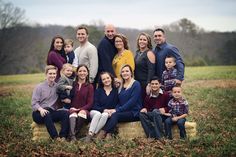 a large family is posing for a photo