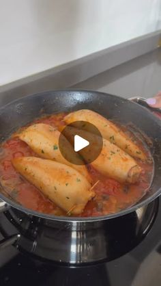 some food is being cooked in a pan on the stove and it looks like they are cooking