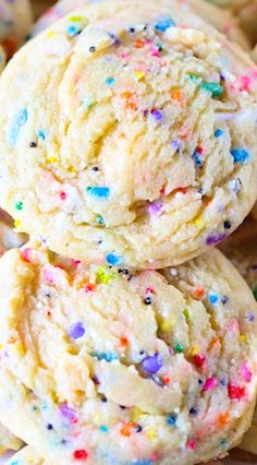 sprinkled cookies are piled on top of each other