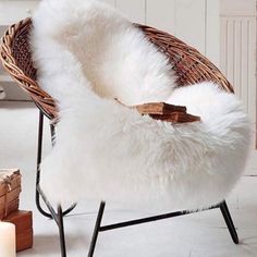 a wicker chair with white fur on it