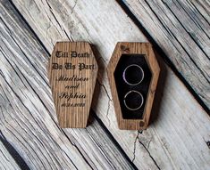 two wedding rings in a wooden ring box