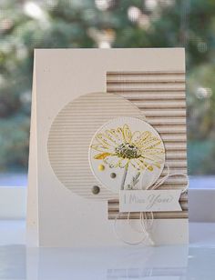 a close up of a card with a flower on the front and back side,