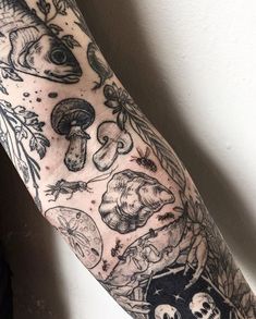 an arm with many different tattoos on it