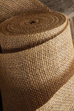 a roll of jute sitting on top of a wooden table