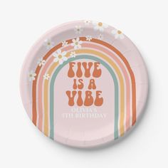 a pink paper plate with an image of a rainbow and flowers on the side that says, five is a yube