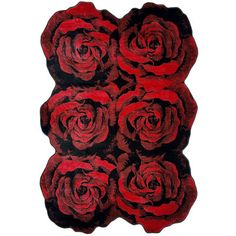 a bunch of red roses sitting on top of a black and red rug with white background