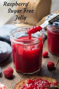 raspberry sugar free jelly in a glass jar with a spoon on the side