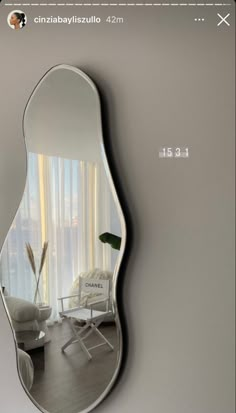 a mirror that is hanging on the wall