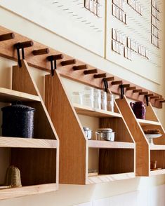 some shelves with pots and pans on them