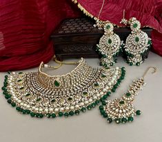 a green and white necklace with matching earrings