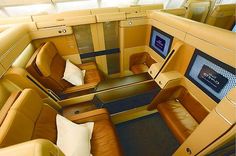 the inside of an airplane with leather seats