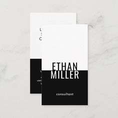 two black and white business cards on a marble surface