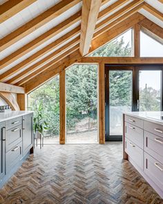 How stunning is this gorgeous kitchen extension with floor to ceiling windows, exposed wood panel work and completed with our very our kitchen cabinetry. Wood Paneling Kitchen, Paneling Kitchen, Kitchen Aesthetic, Floor To Ceiling, Scandinavian Kitchen, Kitchen Extension, Gorgeous Kitchens