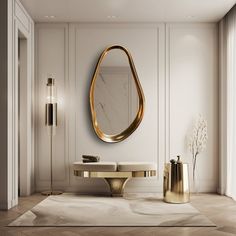 a white and gold bathroom with a round mirror on the wall next to a table