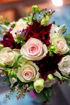 a bouquet of flowers sitting on top of a table