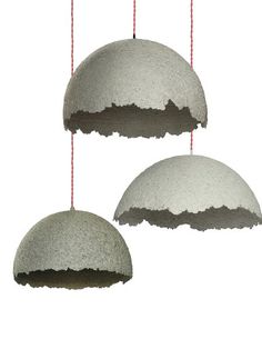 three hanging lights made out of cement