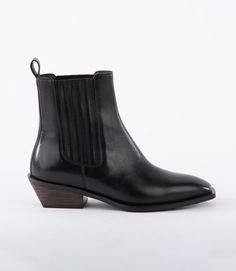 Introducing the Square Toe Booties, the perfect combination of western style and modern edge. These Chelsea boots feature a low heel and easy slip on and off design, making them both fashionable and comfortable. With their water-resistant material, they are the ideal choice for any weather. True to size Upper smooth leather, rubber outsole Heel height: 1.5" Square toe Leather trim elastic insert Easy pull-up strap Imported Seychelles | Karen Kane Square Toe Booties in Black, Size 9.5, Western Pr Black Square Toe Mid-calf Boots, Black Faux Leather Mid-calf Boots With Square Toe, Western Mid-calf Boots With Square Toe And Stacked Heel, Black Square Toe Heeled Boots, Medium Width, Black Western Mid-calf Boots With Square Toe, Karen Kane, The Square, Pull Up, Western Style