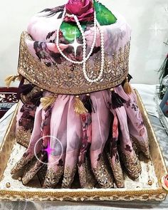 an elaborately decorated cake is displayed on a table