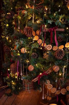 a christmas tree decorated with pine cones and ornaments