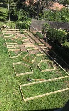 the garden is being built with wooden boards