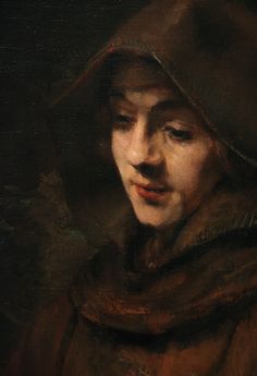 an oil painting of a woman wearing a hood