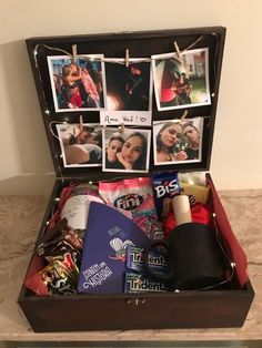 an open suitcase filled with pictures and other items