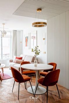 a living room filled with furniture and a white table