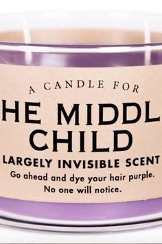 a candle for the middle child is shown in front of a white background with purple lettering