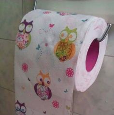 a roll of toilet paper with owls on it