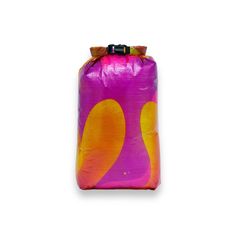 a purple and yellow bag with orange circles on it