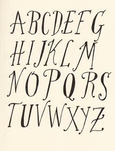 an old english type of alphabet with black ink on white paper, in the style of calligraphy