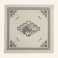 a square scarf with an image of a koala bear on it and stars in the background