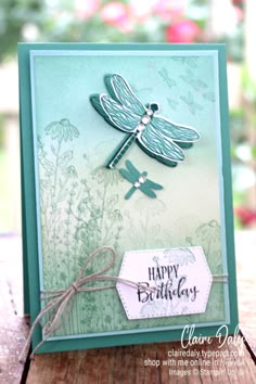 a birthday card with a dragonfly on it