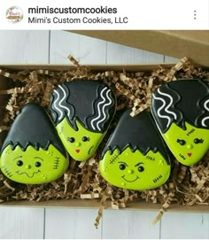 three green and black cookies in a box