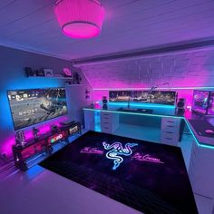 a gaming room with neon lights and video games