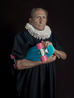 an old man is holding a skateboard in his hands and wearing a black dress