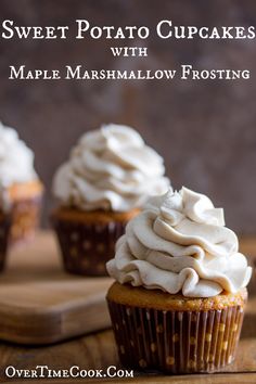 cupcakes with maple marshmallow frosting on a cutting board