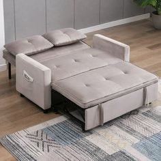 a couch that is sitting on top of a rug