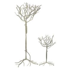 two metal trees with bare branches and no leaves on them, against a white background