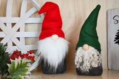 two gnomes sitting next to each other on a shelf