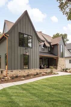 a large gray house with lots of windows