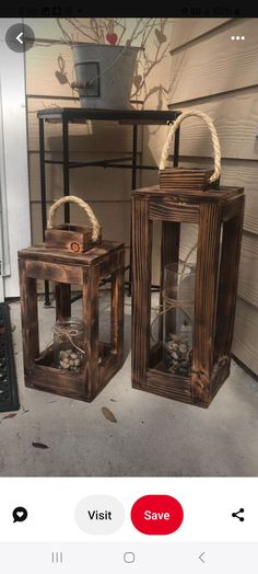 two wooden lanterns sitting next to each other