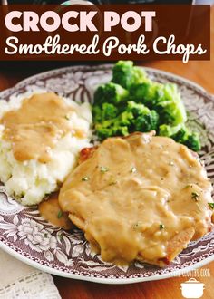 a plate with gravy, mashed potatoes and broccoli on it