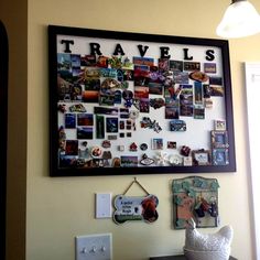 a wall covered in pictures and magnets next to a window