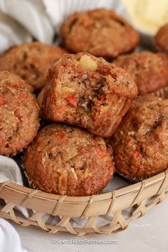 a basket filled with muffins sitting on top of a table